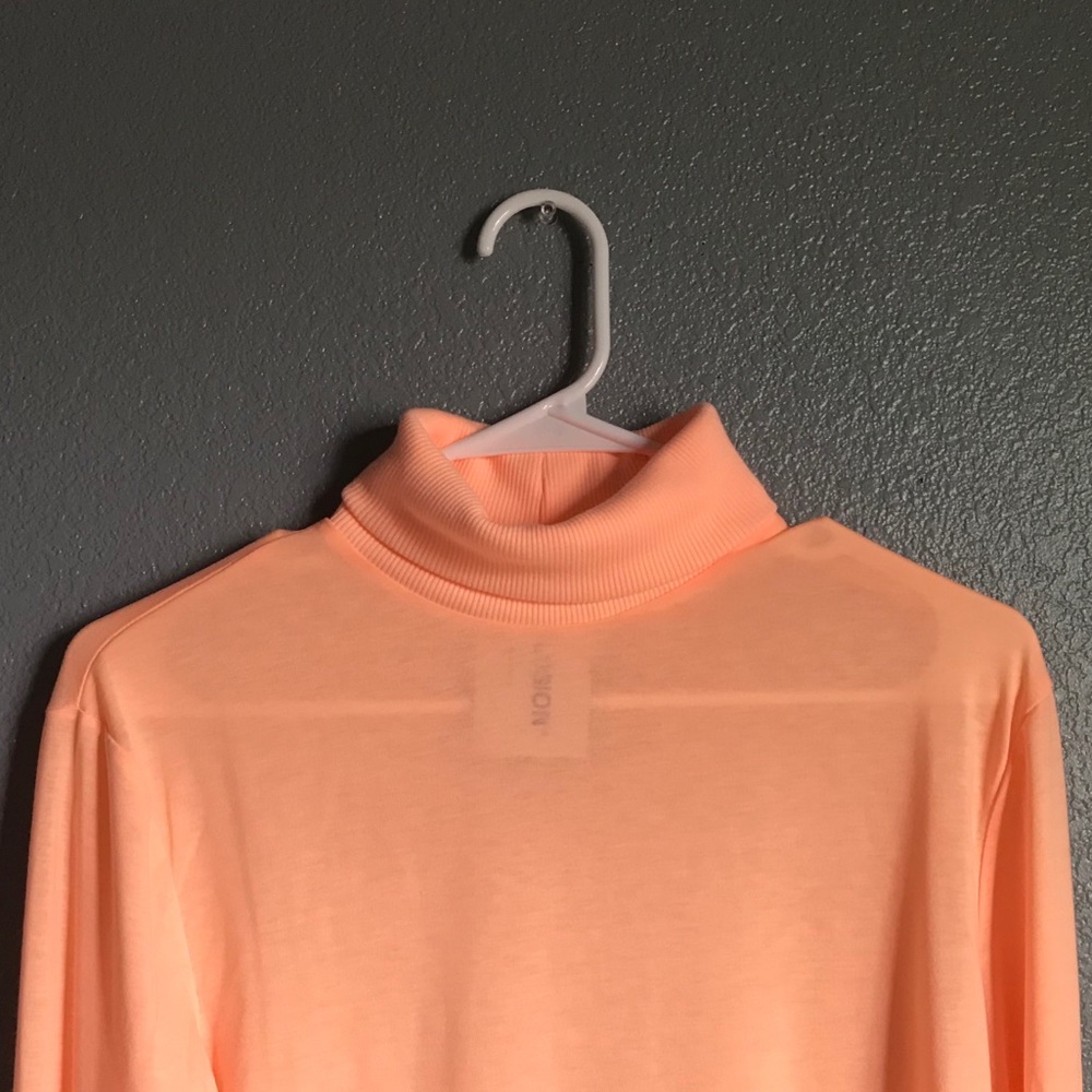 orange turtleneck